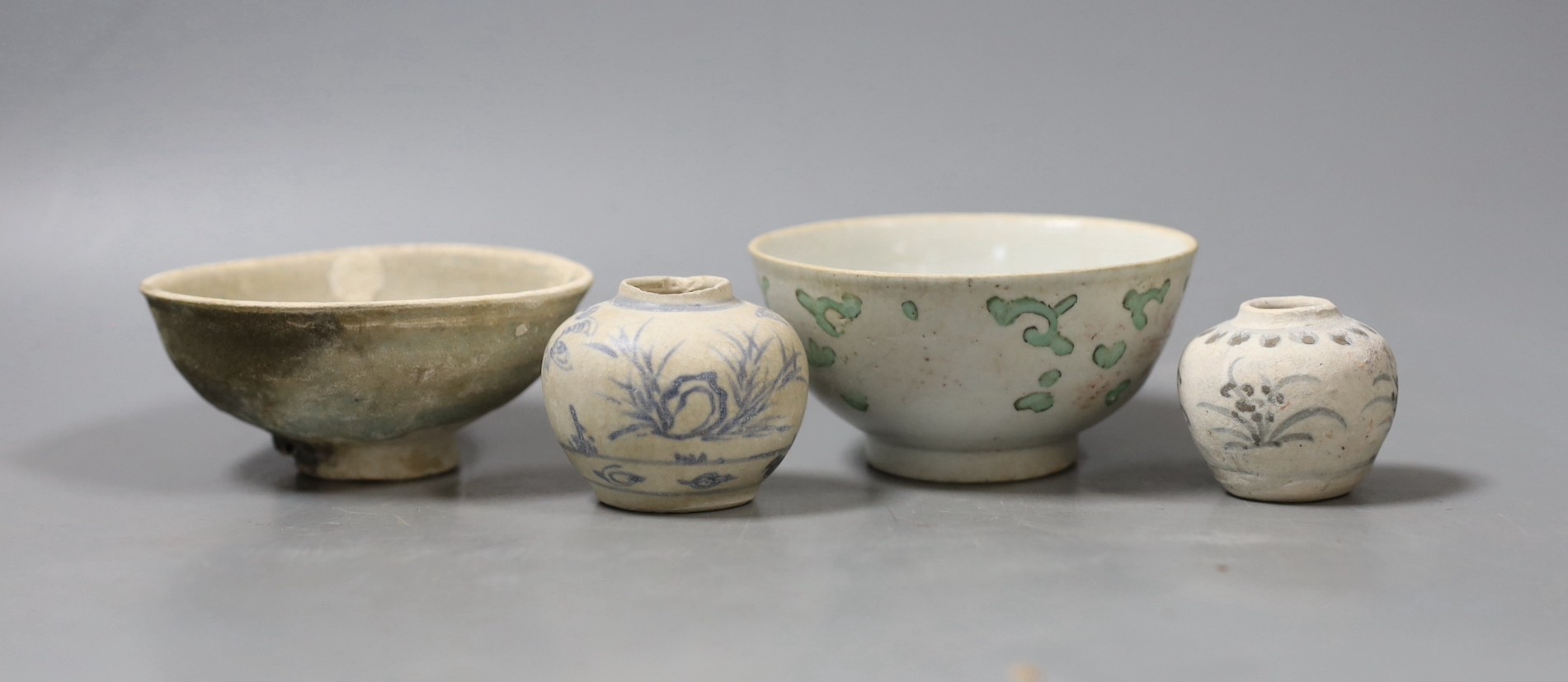 A group of shipwreck ceramics, to include two Ming jarlets, a Qingbai bowl and a Chinese polychrome bowl (4)